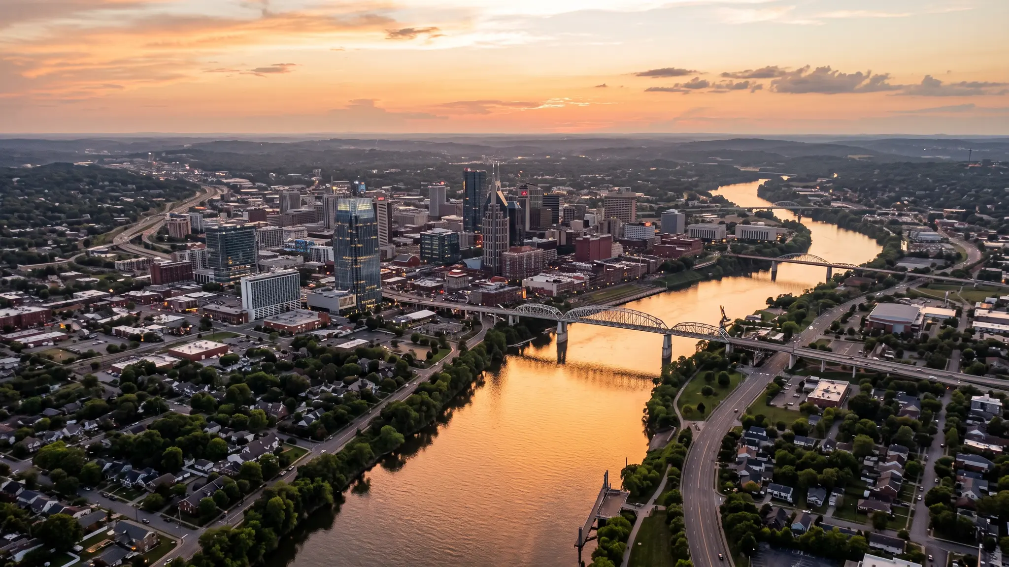Restoration service areas in Middle Tennessee | Music City Remediation Aerial view of the Cumberland River winding past the Nashville skyline and Middle Tennessee farmland at sunset